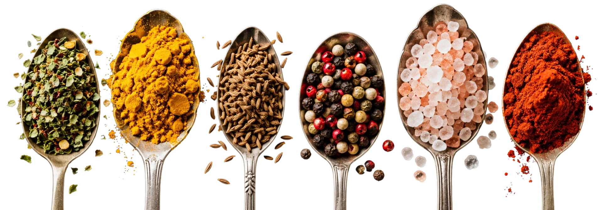 Cucharas con especias: hierbas aromáticas, cúrcuma, comino, pimienta de colores, sal rosa y pimentón